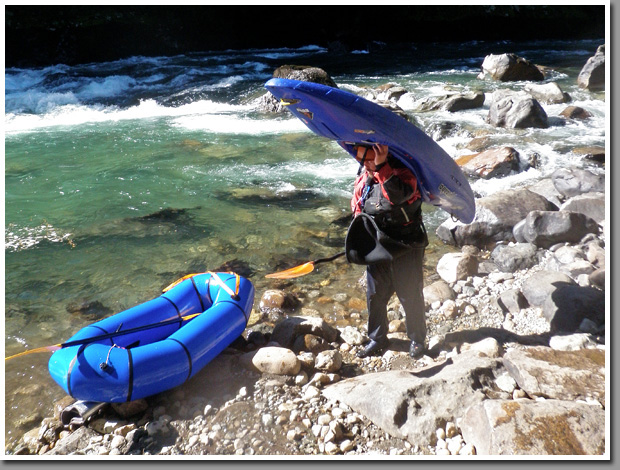 A packraft and a kayaker at the put out at Rio Manso de Frontera at the border between Argentina and Chile, Patagonia, Argentina