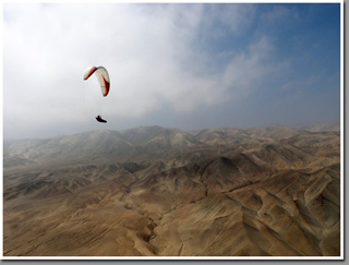Paragliding over the platou above Punta Piedras North of Iquique, The Atacama Desert, Chile Paragliding over the platou above Punta Piedras North of Iquique, The Atacama Desert, Chile
