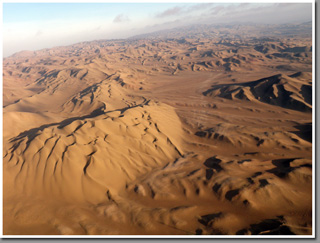 Sunset paragliding over The Barefoot Dunes, Cerro Oyarvide range, Iquique, The Atacama Desert, Chile Sunset paragliding over The Barefoot Dunes, Cerro Oyarvide range, Iquique, The Atacama Desert, Chile