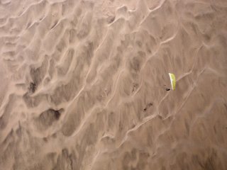 Over the desert - Flying a brand new competition paraglider over the mountain dunes on a long XC in the desert, Iquique, The Atacama Desert, Chile