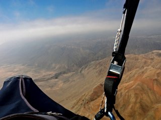 Up in clouds - Jarek Wieczorek gliding along the Atacama Desert coastal range in the Loa river area, The Atacama Desert, Chile