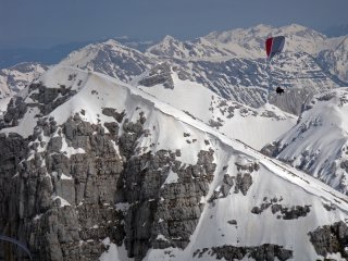 Over Krn - Spring paragliding over Krn - the highest mountain around Soca Valley, Julian Alps, Slovenia